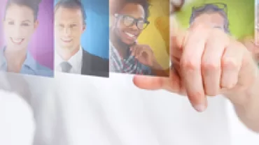 Person selecting images from a holographic display.