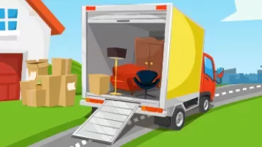 Moving truck parked with furniture and boxes on a driveway.