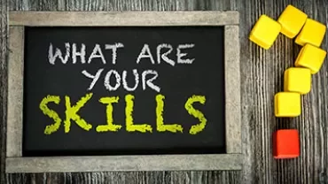 Chalkboard with 'What are your skills?' and colored blocks forming a question mark.