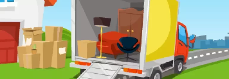 Moving truck parked with furniture and boxes on a driveway.