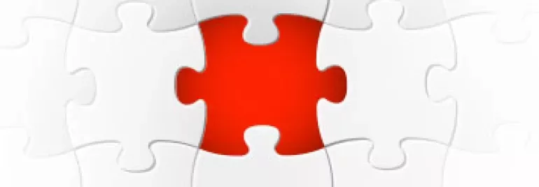 Rood puzzelstuk in een voltooid witte puzzel.